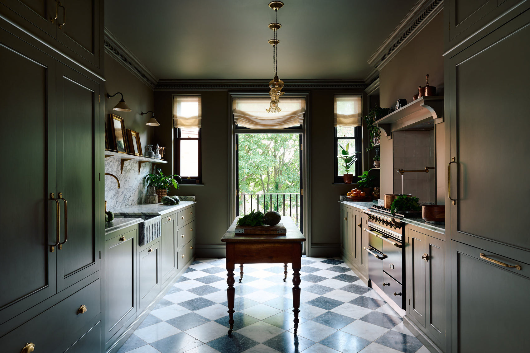 A grand olive-green Classic English kitchen